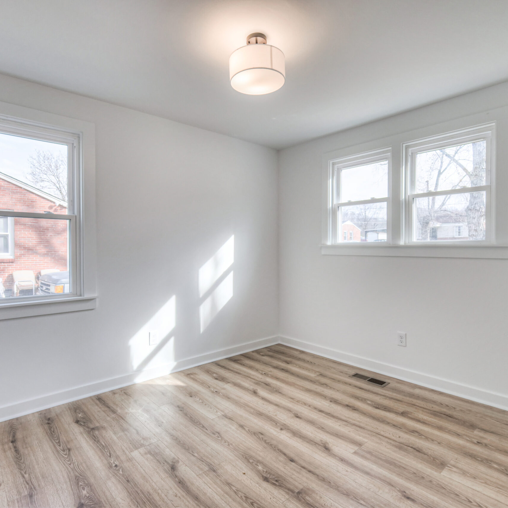 New luxury vinyl plank flooring in a freshly renovated room